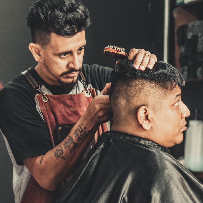 Barber cutting a client's hair
